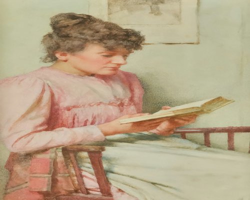 Woman reading a book comfortably with natural light